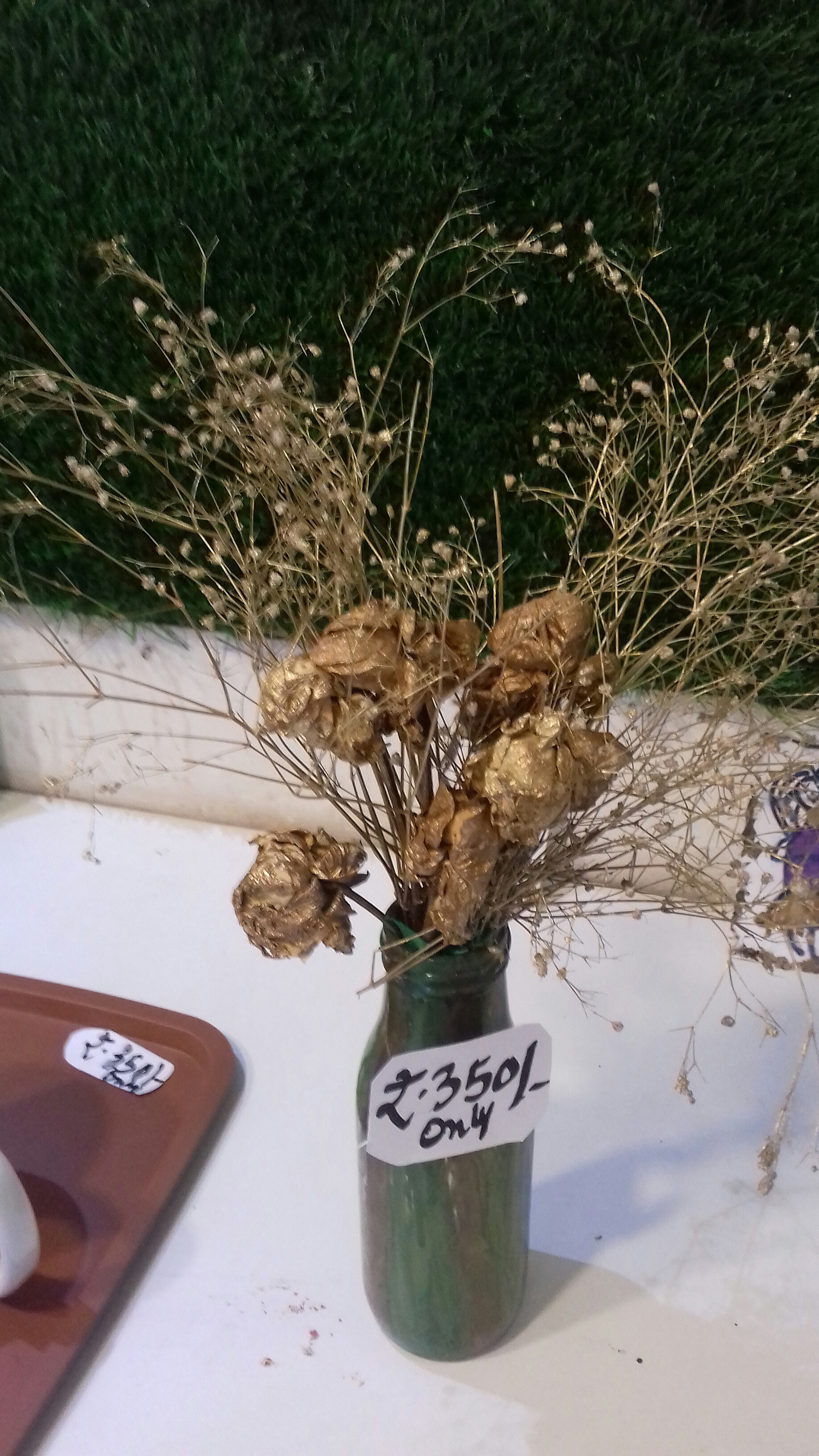 Dried & coloured flowers arranged in handpainted vase